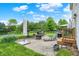 Outdoor patio with a seating area, grill, and a landscaped backyard at 286 Fairfax Ln, Greenwood, IN 46142