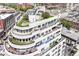 Stunning aerial view of a modern condo building featuring multiple terraces and a rooftop garden at 333 Massachusetts Ave # 303, Indianapolis, IN 46204