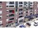 Close up view of condo building with many balconies and storefronts on the lower level at 333 Massachusetts Ave # 303, Indianapolis, IN 46204