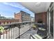 Charming balcony offering an outdoor grill and seating area with a view of the street at 333 Massachusetts Ave # 303, Indianapolis, IN 46204