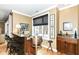 Stylish bar area with granite countertops, bar stools, and a window with city views at 333 Massachusetts Ave # 303, Indianapolis, IN 46204