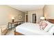 Comfortable bedroom with bed, woven chair and desk that offers space for rest and productivity at 333 Massachusetts Ave # 303, Indianapolis, IN 46204
