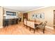 Open-concept dining area with hardwood floors, bar, and modern decor at 333 Massachusetts Ave # 303, Indianapolis, IN 46204