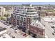 Luxury condominium building with modern architectural design and many balconies overlooking a city neighborhood at 333 Massachusetts Ave # 303, Indianapolis, IN 46204