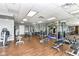 Well-equipped gym featuring a variety of exercise machines and free weights on wood flooring at 333 Massachusetts Ave # 303, Indianapolis, IN 46204