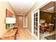 Inviting hallway with light hardwood floors leads to the front door and a stylish office space at 333 Massachusetts Ave # 303, Indianapolis, IN 46204