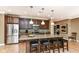 Modern kitchen with stainless steel appliances, granite countertops, and a center island at 333 Massachusetts Ave # 303, Indianapolis, IN 46204