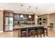 This modern kitchen offers dark wood cabinets, stainless steel appliances, and a granite-topped breakfast bar at 333 Massachusetts Ave # 303, Indianapolis, IN 46204