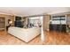 Bright living room boasting hardwood floors, a balcony, and a built-in bar area at 333 Massachusetts Ave # 303, Indianapolis, IN 46204