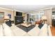 Open-concept living room with a fireplace, balcony access, and comfortable seating at 333 Massachusetts Ave # 303, Indianapolis, IN 46204
