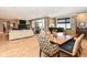 Inviting open-concept living space featuring a dining area, bar, cozy seating, and balcony access at 333 Massachusetts Ave # 303, Indianapolis, IN 46204