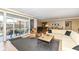 Bright living room with balcony access and views of the surrounding cityscape at 333 Massachusetts Ave # 303, Indianapolis, IN 46204