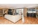 Bright and open living room featuring a fireplace, TV, a bar area, and a balcony at 333 Massachusetts Ave # 303, Indianapolis, IN 46204