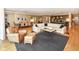 Spacious living room with modern decor, hardwood floors, and abundant natural light at 333 Massachusetts Ave # 303, Indianapolis, IN 46204