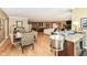 Open concept living space with a kitchen, dining area, bar area, and living room at 333 Massachusetts Ave # 303, Indianapolis, IN 46204