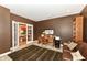 Office with desk, bookshelf, leather couch and French doors to maximize your work from home at 333 Massachusetts Ave # 303, Indianapolis, IN 46204