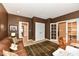 Office featuring a couch, doors to other rooms, desk, and artwork for a functional and attractive space at 333 Massachusetts Ave # 303, Indianapolis, IN 46204