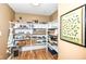A large pantry features ample shelving for storage and organization, offering convenience and functionality at 333 Massachusetts Ave # 303, Indianapolis, IN 46204