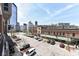 Street view showcasing nearby businesses and residential buildings in a vibrant urban environment at 333 Massachusetts Ave # 303, Indianapolis, IN 46204