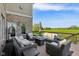 Relaxing back deck with comfortable seating and a picturesque view of the open green space at 3384 Homestretch Dr, Carmel, IN 46032