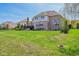Expansive backyard with a beautiful patio, outdoor kitchen, and lush lawn, great for outdoor activities at 3384 Homestretch Dr, Carmel, IN 46032