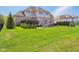 Spacious backyard featuring a deck, outdoor kitchen, and a large lawn, perfect for Gathering gatherings at 3384 Homestretch Dr, Carmel, IN 46032