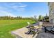 Serene backyard patio featuring comfortable Adirondack chairs and a fire pit, perfect for outdoor relaxation at 3384 Homestretch Dr, Carmel, IN 46032