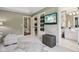 Well designed bedroom with TV, seating, and access to bathroom at 3384 Homestretch Dr, Carmel, IN 46032