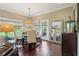 Bright dining area with hardwood floors, large mirror, and views to the outside at 3384 Homestretch Dr, Carmel, IN 46032