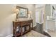 Hallway with hardwood floors and a decorative mirror at 3384 Homestretch Dr, Carmel, IN 46032
