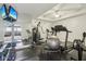 Well-equipped home gym with a treadmill, stationary bike, and weight training equipment at 3384 Homestretch Dr, Carmel, IN 46032