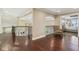 Spacious hallway boasts hardwood floors, decorative wrought iron railings, and an open view to other living spaces at 3384 Homestretch Dr, Carmel, IN 46032