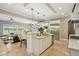 Open concept kitchen featuring a large island, stainless steel appliances, and neutral tones at 3384 Homestretch Dr, Carmel, IN 46032