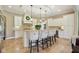A gourmet kitchen with an island, pendant lighting, and stainless steel appliances at 3384 Homestretch Dr, Carmel, IN 46032