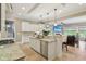 Modern kitchen with a granite island, white cabinets, and stainless steel appliances at 3384 Homestretch Dr, Carmel, IN 46032