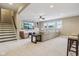 Bright living room featuring a wall-mounted TV, a comfortable sectional, and barstool seating at 3384 Homestretch Dr, Carmel, IN 46032