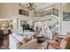 Expansive living area with a grand piano, soaring ceilings, and open staircase to second level at 3384 Homestretch Dr, Carmel, IN 46032