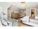 Comfortable main bedroom with a desk, full-length mirror, and seating at 3384 Homestretch Dr, Carmel, IN 46032