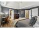 Comfortable main bedroom with gray walls, a tray ceiling, and en suite bathroom at 3384 Homestretch Dr, Carmel, IN 46032
