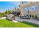 Gorgeous outdoor kitchen and patio area perfect for entertaining, featuring a grill and dining space at 3384 Homestretch Dr, Carmel, IN 46032