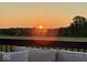 Deck view featuring a landscape with trees in front of the sunset at 3384 Homestretch Dr, Carmel, IN 46032