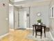 Entryway with wood floors, table, and area rug at 355 E Ohio St # Ste 105, Indianapolis, IN 46204