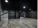 Unfinished basement featuring painted brick walls, a drop ceiling, and vinyl floors at 3628 N Illinois St, Indianapolis, IN 46208