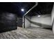 Unfinished basement featuring painted brick walls, a drop ceiling, and vinyl floors at 3628 N Illinois St, Indianapolis, IN 46208