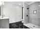 Clean bathroom with gray vanity, tiled shower, and marble floors for a luxurious feel at 3628 N Illinois St, Indianapolis, IN 46208