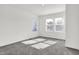 Spacious bedroom offering great natural light from the window with neutral walls and soft carpeting at 3628 N Illinois St, Indianapolis, IN 46208