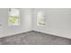 Bedroom with large windows with neutral paint throughout, offering abundant natural light and comfortable living space at 3628 N Illinois St, Indianapolis, IN 46208