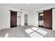Bright bedroom with barn doors and a bathroom ensuite; a large, airy space at 3628 N Illinois St, Indianapolis, IN 46208