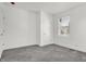 Bedroom with gray carpet, white walls, and a window letting in natural light at 3628 N Illinois St, Indianapolis, IN 46208