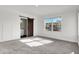 Bright bedroom with a sliding barn door that leads to the en suite bathroom with double sinks and great natural light at 3628 N Illinois St, Indianapolis, IN 46208